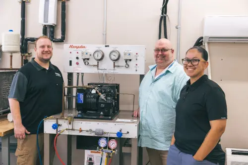 HVAC technology students around training equipment