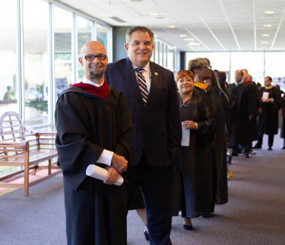 Centura College graduates standing in line after getting their diplomas