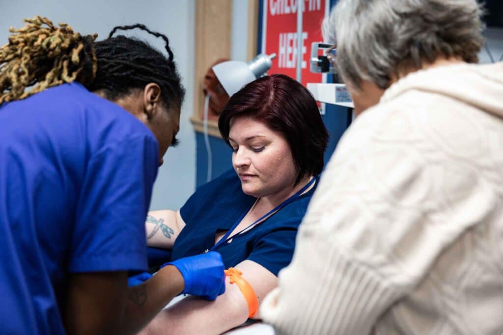 medical assistant taking blood